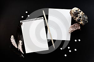 White notebook mockup template on black background with magical mysterious mood.