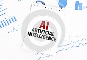 White notepad with text AI - Artificial Intelligence on the financial documentation. Finance and business concept