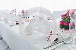 White nuptial decorated wedding table with napkin photo