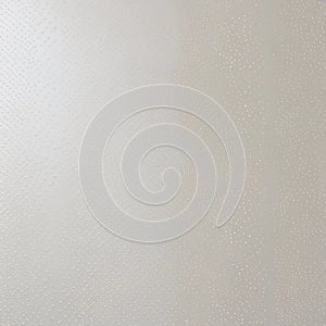 A white object decorated with various dots, creating a visually appealing pattern on its surface