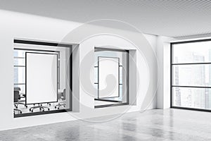 White office corridor with two mockups in windows. Corner view