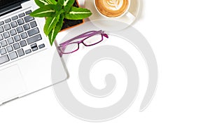 White office desk table with laptop computer, Latte art hot coffee and eye glasses