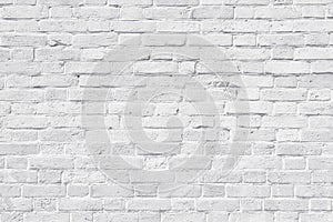 White old brick wall texture. Rough light grey brickwork. Weathered masonry background