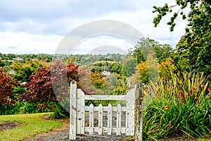 White old-fashioned gate in landscape.