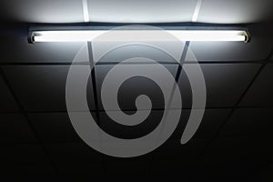 White old fluorescent lamp on ceiling