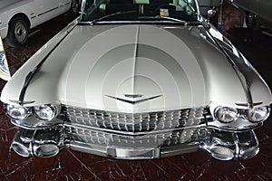White old retro car Cadillac Fleetwood 1959 shot front and top