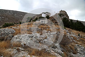 A white, old, villiage house on the top of the hill in Calymnos IslandÃ¦