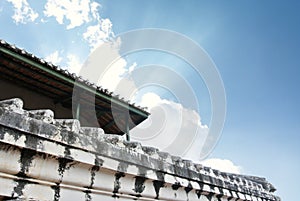 White old wall of asian temple on hill
