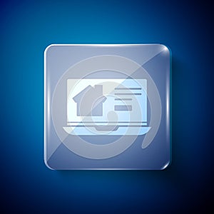 White Online real estate house on laptop icon isolated on blue background. Home loan concept, rent, buy, buying a