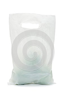 White opaque plastic bag with green apples