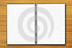 White open notebook on wood