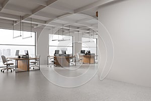 White open space office corner with blank wall