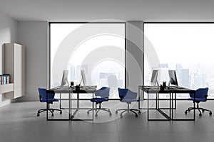 White open space office interior with blue chairs