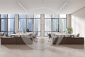 White open space office interior with wooden desks and window