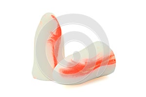 White-orange earplugs isolated on white background.Close-up.Soft foam earplug