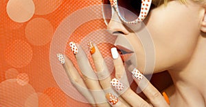 White orange manicure and makeup .