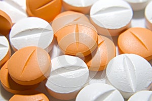 White and orange pills