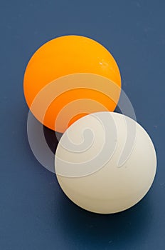 White and orange ping pong ball