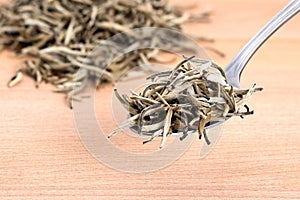 White Organic Needle Tea on Cutting Board