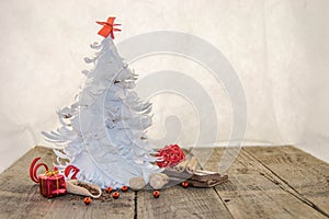 White origami Christmas tree with red decorations