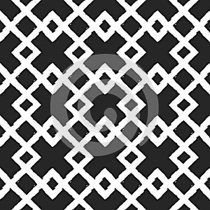 White ornament on a black background. Intersecting rhombs. Painted by hand rough brush. Geometric seamless grunge pattern. photo