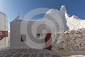 White orthodox church and houses in Mykonos, Greece