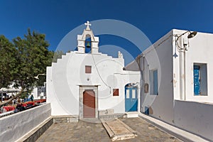 White orthodox church and small bell tower in Mykonos, Greece