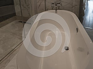 White oval acrylic bathtub. View from above.