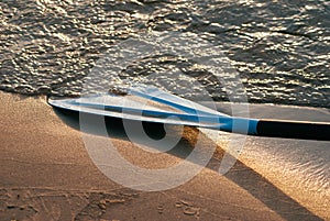 White paddle at sunset close-up, active lifestyle