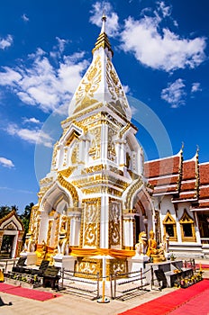 White pagoda decorate with gold agiant blue sky