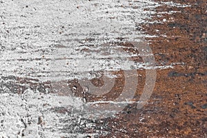 White paint abstract pattern on the surface of an old rusty metallic texture steel background rust brown