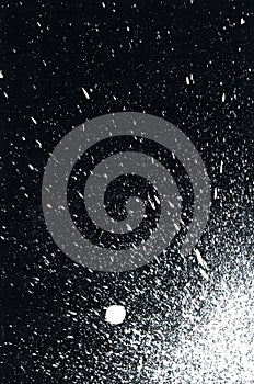 White paint splatter on black background