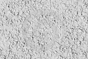 White paint on stone pebble surface solid texture wall background