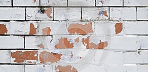 The white painted brick wall cracked for background. Pattern line of wallpaper.