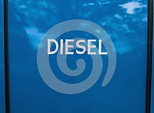 White painted diesel sign on blue background