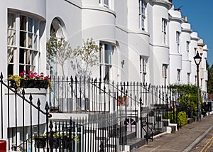 White painted Grade II listed Georgian town houses in the Guildford Lawn conservation area, in Ramsgate, Kent UK.