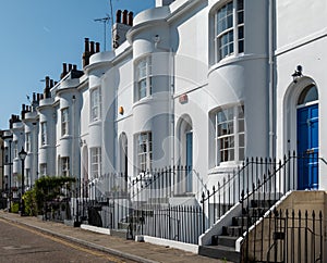 White painted Grade II listed Georgian town houses in the Guildford Lawn conservation area, in Ramsgate, Kent UK.