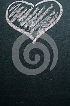 White painted heart on a black background