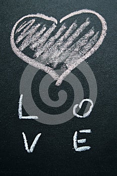 White painted heart on a black background