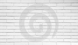 white painted modern brick wall used as panoramic background in close up view. detail of a white brick wall texture