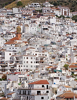 White painted Spanish houses cover the hillside. Competa, Spain.