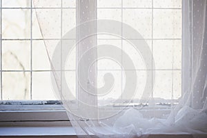 White painted window with old wooden frame.The interior of the apartment or house. Daylight