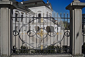 White palace and black fence with golden elements