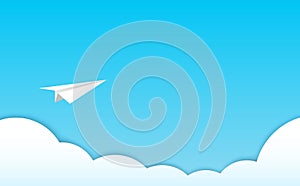 White paper airplane above clouds on blue sky. Paper layers cutout