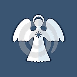 White paper angel with a christmas star on a dark blue background.