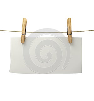 White paper attached to a rope clothespin