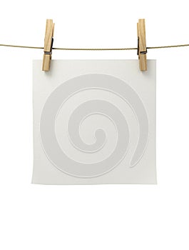 White paper attached to a rope clothespin