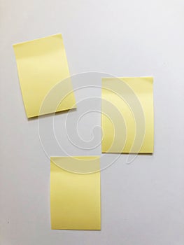 White paper background and yellow notes on it Small papers on white background