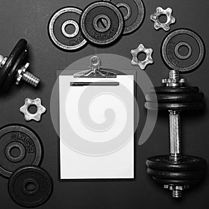 White paper board and exercise tools - Concept for workout plan - Flat lay minmal design