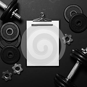 White paper board and exercise tools - Concept for workout plan - Flat lay minmal design